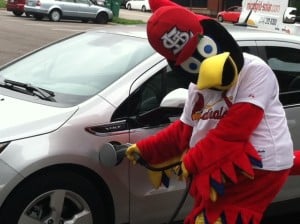 STL Cardinals' Fredbird using an electric vehicle charging station at Busch Stadium