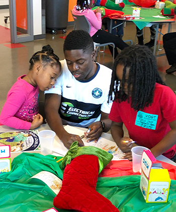 St. Louis soccer player helping kids