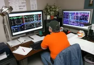 Electrician designing a wiring plan on computer