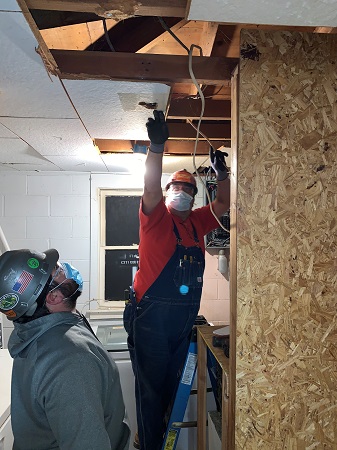 Electricians from Pioneer Electric make repairs to the Ozark Food Pantry